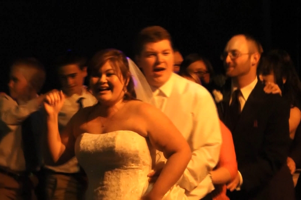 Conga line with bride and groom leading